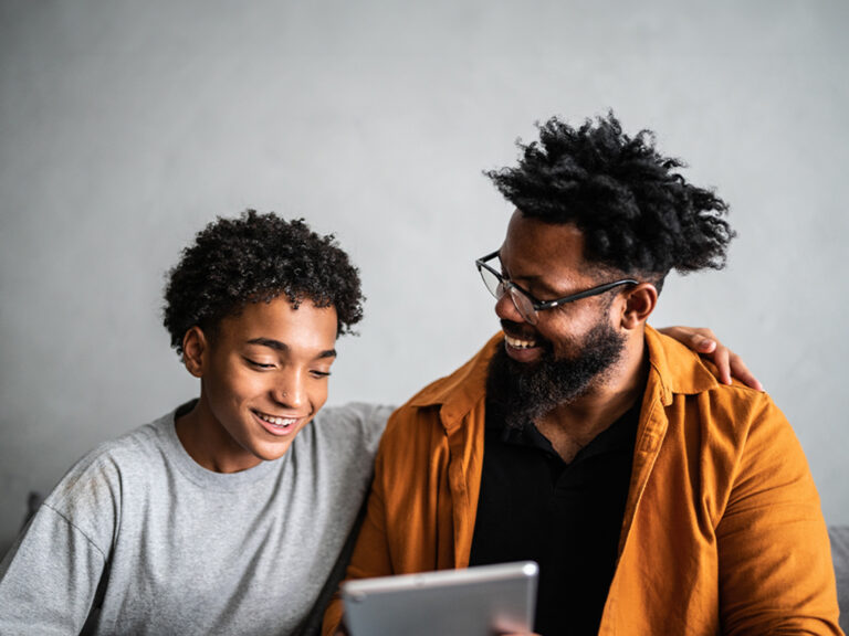 parent and student looking at student checking account offered by Amerant