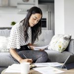 woman checking notes business savings