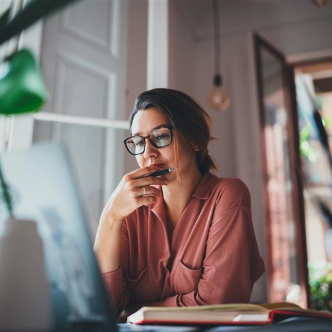 woman looking at laptop